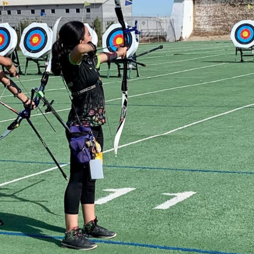 Elisa practicing archery